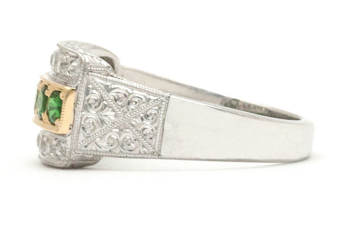 A tapered palladium band with tsavorite and diamonds.